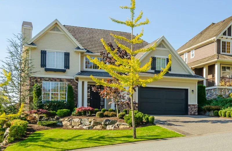 exterior of two story home with nice front lawn