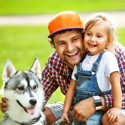 Family outside with pet dog